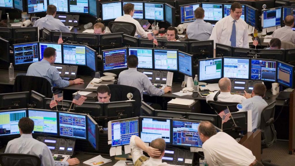 Proprietary trading desk with multiple monitors