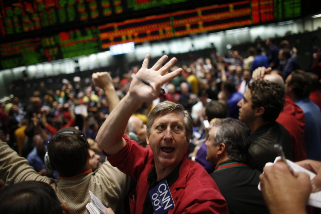 Stock market traders shouting on the trading floor